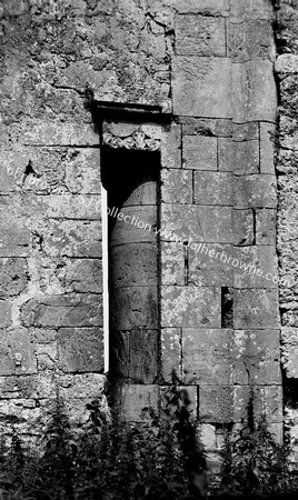 ONE OF THE PILLARS OF THE OLD MILL SURROUNDED BY THE EXTENSION OF N.WALL OF CHANCEL